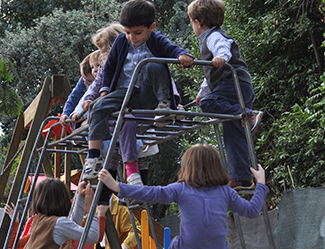A photograph shows children climbing on playground equipment.